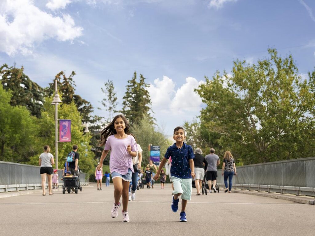 Kids running on zoo grounds